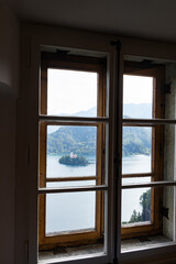 Panoramic view from Lake Bled, beauty heritage in Slovenia. Island with church and castle in the background create a dream setting. View from the castle, museum and court.