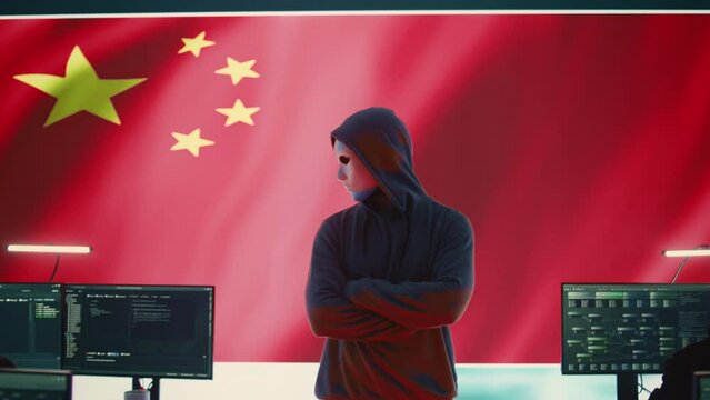 Chinese anonymous hackers group supervises criminal activity and propaganda in Chinese cybersecurity center with the national flag. Spreading fake news about the autocracy and dictatorship. Camera B.