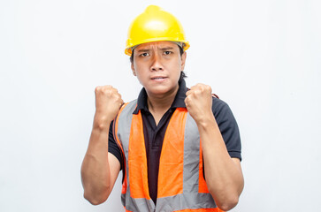 stressed overworked concept illustrated by asian male construction worker in orange vest and yellow safety helmet with furious, mad, sad, angry expression. 