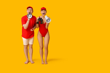 Lifeguards with binoculars and megaphones on yellow background