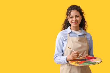 Female African-American artist on yellow background