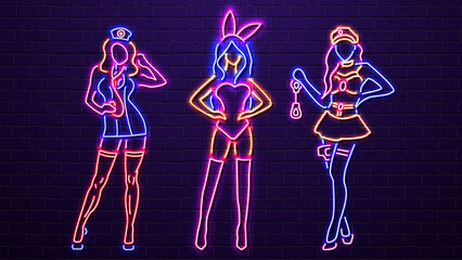 Sexy neon girls in lingerie on a brick wall background. A concept for a sex shop.