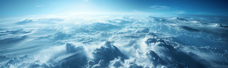 A breathtaking view of clouds from above, showcasing the vast expanse of the sky and its serene beauty.