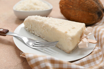 Plate with tasty cheesecake pop on table