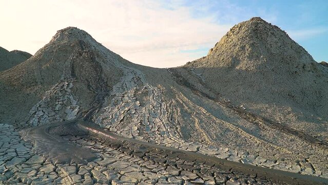 Mud volcano. Always active mud volcanoes surrounded by mountains