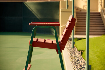 Side view of an umpire's chair on a tennis court