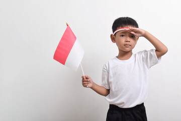 Cute little Asian boy giving salute celebrate Indonesian independence day on August 17 isolated on white background
