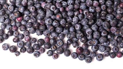 Healthy vitamin food. Ripe berries of fresh sweet bilberries on white background..