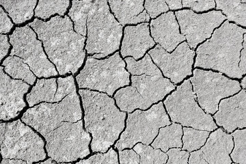 Wall texture soil dry crack pattern of drought lack of water of nature brown old broken background.