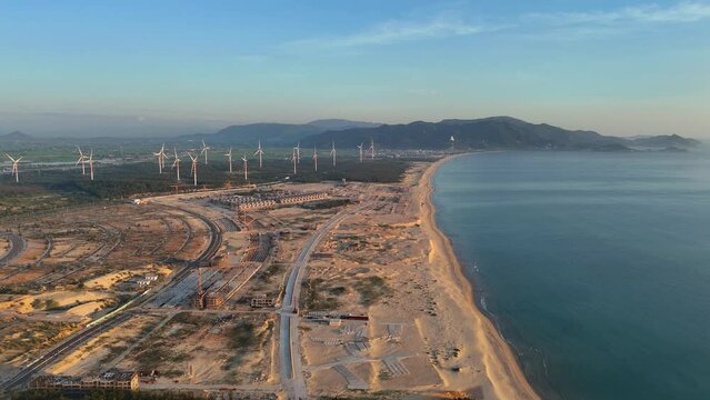 Wind turbines at FLC Nhon Ly seaside, turbine rotating to make green alternative energy with cheap for indusrtry and save environment