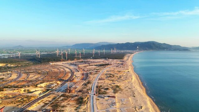 Wind turbines at FLC Nhon Ly seaside, turbine rotating to make green alternative energy with cheap for indusrtry and save environment
