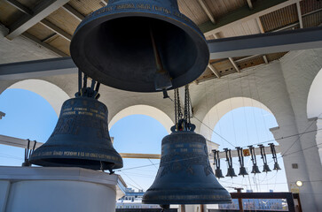 Fototapeta premium A large bell on the bell tower of the Transfiguration Cathedral of the ancient Kremlin in Nizhny Novgorod