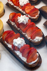 French cuisine, fresh baked iced strawberry cake with chantilly cream, sweet dessert