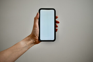 Hand holding mobile phone, mockup photo, tech mockup photos