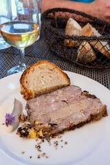Terrine foie gras fat liver specialty food product made of liver of a duck or goose fattened by force feeding, served in French restaurant in Perigoed, Dordogne, close up