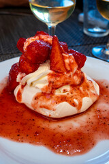 Sweet french dessert, Red strawberry fruit pavlova served in restaurant in Saint-Tropez, France