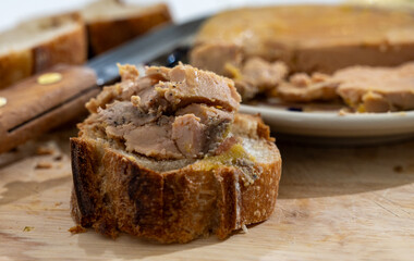 Foie gras fat liver specialty food product made of liver of a duck or goose fattened by gavage, force feeding, served in French restaurant in Perigoed, Dordogne, close up © barmalini