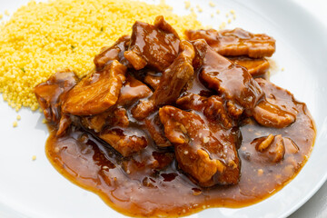 Meat dish Caramel pork served with couscous