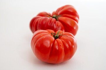 Sweet tasty ripe red french tomatoes from Brittany, France, salad seasonal vegetables