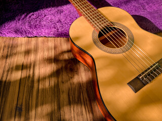 Obraz premium Classical guitar with natural sunlight background. Copy Space. Music Instruments design.