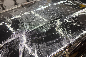 Workshop process of applying protective film to safeguard car headlights from scratches and damage