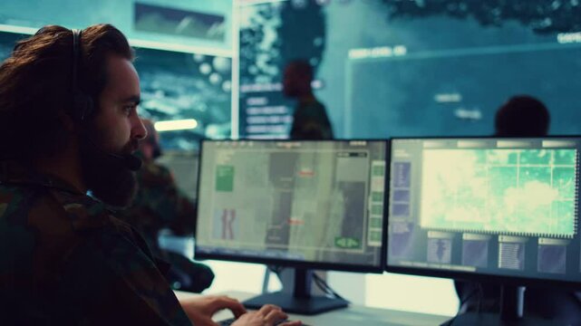 Commander communicating with allied forces and transmitting data from surveillance footage, coordinating joint operations and strategies to accomplish mission. Satellite radar operator. Camera B.