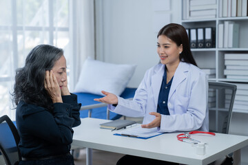 During a consultation in the office, female patients received advice on options and engaged in discussions about their overall health and treatment plans. This interaction between medical professional