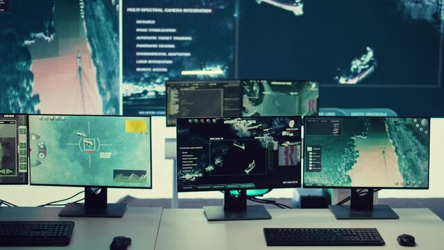 Federal agency command center equipped with surveillance and satellite system overseeing threats or danger on a world map. Military control room headquarters with a dashboard.