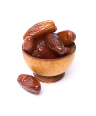 Dried dates fruits in wooden bowl