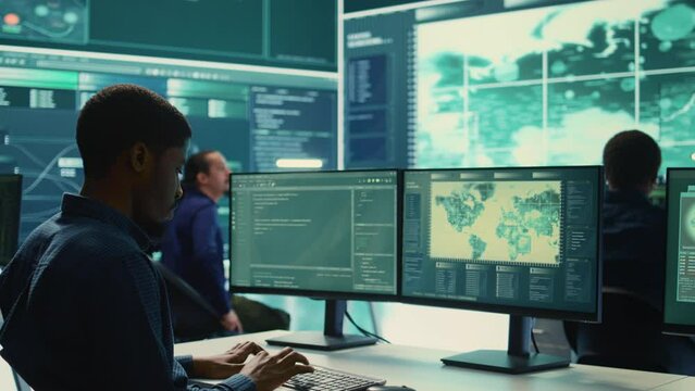 Cyber security experts team working on encryption and IT security in a governmental agency. Specialists working on cyber operations, network security and data protection for national safety. Camera B.