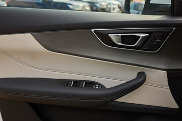 Fototapeta premium A car door with trim showcasing automotive design details