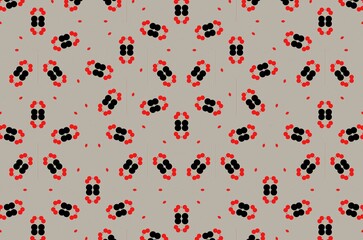 A pattern of black and red dot shapes on a gray background