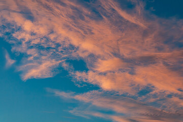 Red veil clouds with blue sky in the background