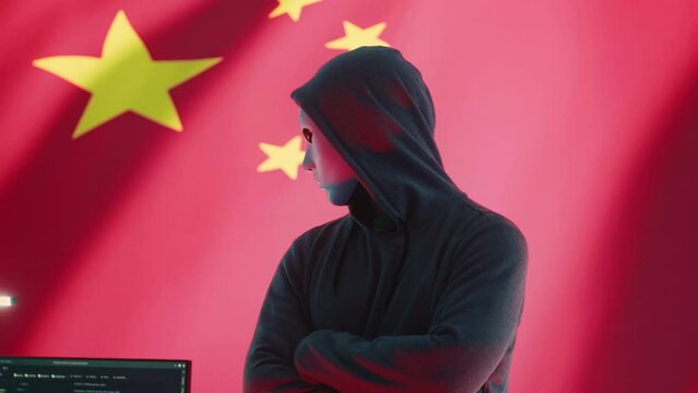 Chinese anonymous hackers group supervises criminal activity and propaganda in Chinese cybersecurity center with the national flag. Spreading fake news about the autocracy and dictatorship. Camera A.