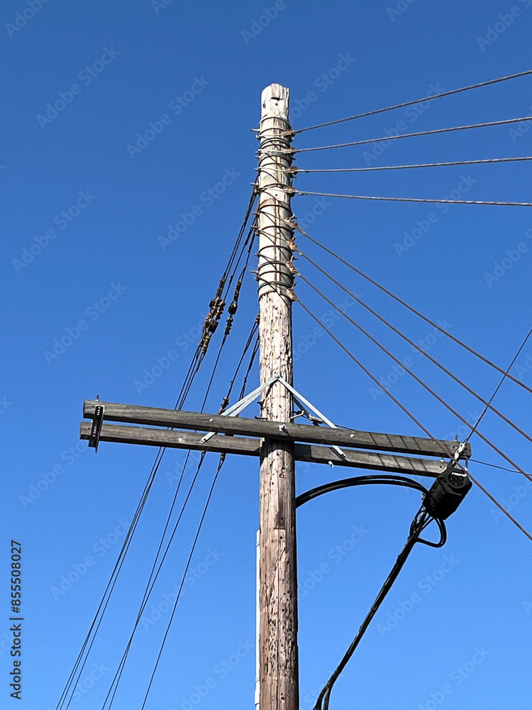 Wall mural electricity pylon under blue sky