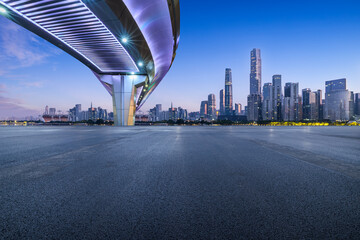 Asphalt road and bridge with modern city buildings scenery at night in Guangzhou