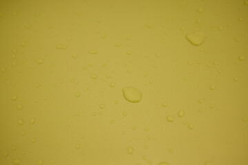 A serene image of water droplets on a smooth surface, capturing a tranquil and peaceful scene