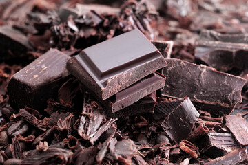 Dark chocolate. Broken chocolate bar on kitchen table