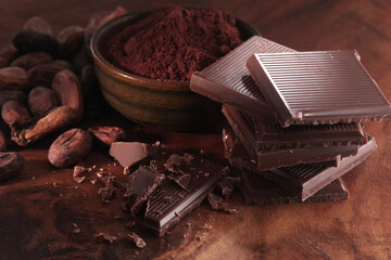 Dark chocolate. Broken chocolate bar on kitchen table
