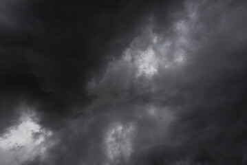 Dramatic dark storm rain clouds black sky background. Dark thunderstorm clouds rainny atmosphere. Meteorology danger windstorm disasters climate. Dark cloudscape storm disaster gloomy gray cloud sky