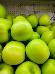 Photo of natural organic ripe sweet green apples. Sweet, fresh and healthy fruit.