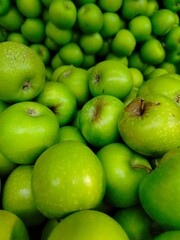 Photo of natural organic ripe sweet green apples. Sweet, fresh and healthy fruit.