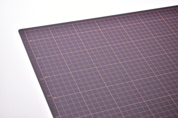 black cutting mat board on white background with line and scale measure guide pattern for object...