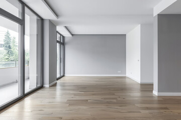 Empty room interiors in neutral tones with minimal or no furniture in a residential interior design composition. Apartment interior with ample copy space.