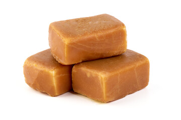 Cheesecake candy bar with caramel glaze, caramel curd cheese, isolated on white background.