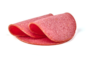 Thin salami sausage slices, isolated on white background.