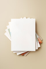 Stack of blank paper on beige background