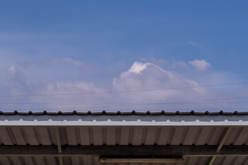 The copy space of the cloud in the sky on the metal roof