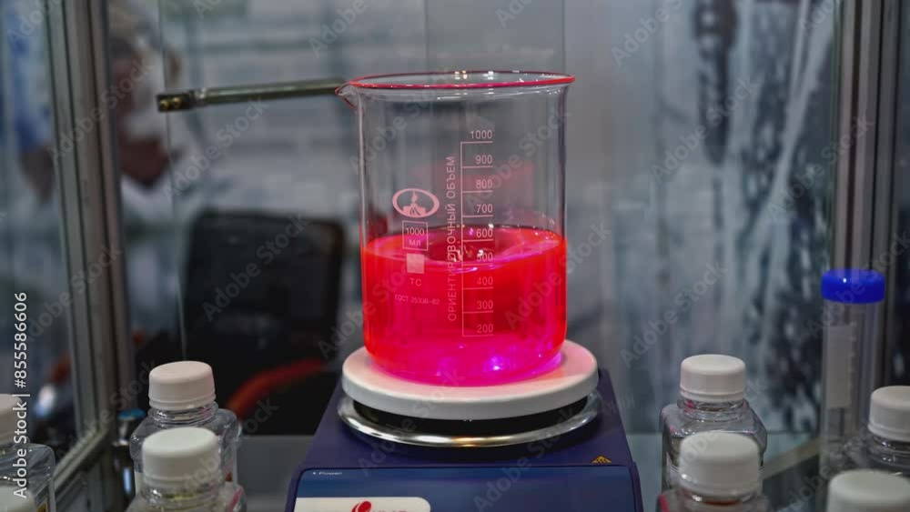 Poster rotating colored liquid in laboratory container. media. laboratory examination with colored liquid i