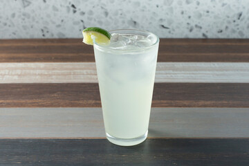 A view of a mojito in a tall glass.